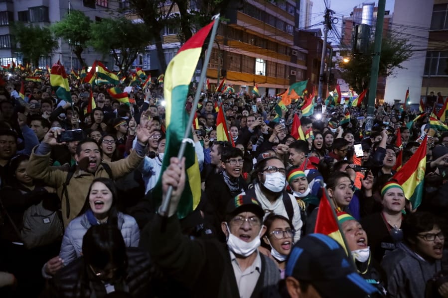 Anti-government protesters march Tuesday against early presidential election results in La Paz, Bolivia.
