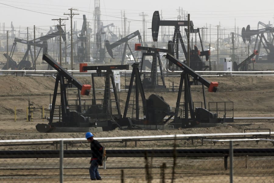 FILE - This Jan. 16, 2015, file photo shows pumpjacks operating at the Kern River Oil Field in Bakersfield, Calif. California Gov. Gavin Newsom on Saturday, Oct. 12, 2019, signed a law intended to counter Trump administration plans to increase oil and gas production on protected public land. (AP Photo/Jae C.
