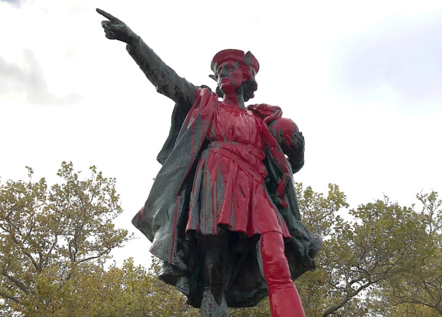 Red paint covers a statue of Christopher Columbus on Monday, Oct. 14, 2019, in Providence, R.I., after it was vandalized on the day named to honor him as one of the first Europeans to reach the New World. The statue has been the target of vandals on Columbus Day in the past. (AP Photo/Michelle R.
