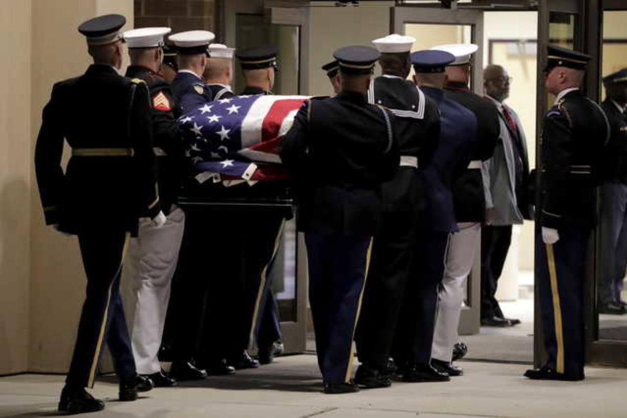 Mourners pay respects to Cummings during wake before funeral