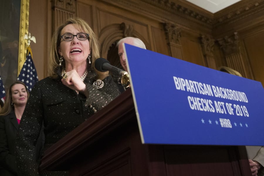 FILE - In this Jan. 8, 2019, file photo, former Rep. Gabby Giffords, speaks during a news conference to announce the introduction of bipartisan legislation to expand background checks for sales and transfers of firearms, on Capitol Hill in Washington. Ten White House hopefuls will participate Wednesday in an all-day forum on gun policy hosted by MSNBC, March for Our Lives and Giffords.  March for Our Lives is the student-led gun control movement sparked by the high school shooting in Parkland, Florida, last year, and Giffords is the advocacy organization set up by former Arizona congresswoman Gabby Giffords, who was shot in the head during a constituent meeting in 2011.