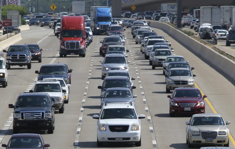 FILE - In this July 1, 2016 file photo, drivers work their way out of Dallas during rush hour. The U.S. government's road safety agency says traffic deaths fell by a small amount for the second straight year. The National Highway Traffic Safety Administration attributed the 2.4% drop partially to technology in newer vehicles that can prevent crashes. The agency says the downward trend is continuing into 2019. First-half estimates show fatalities down 3.4%.