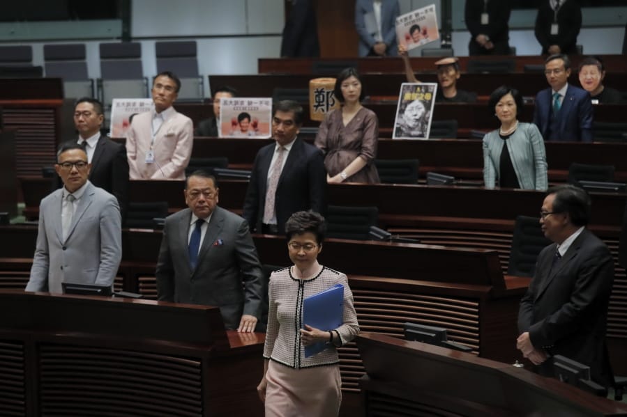 Hong Kong Chief Executive Carrie Lam, center, walks into Legislative Council in Hong Kong Wednesday, Oct. 16, 2019. In chaotic scenes, furious pro-democracy lawmakers twice forced Hong Kong&#039;s leader to stop delivering a speech laying out her policy objectives and clamored for her to resign after she walked out of the legislature on Wednesday and then delivered the annual address 75 minutes late via television.