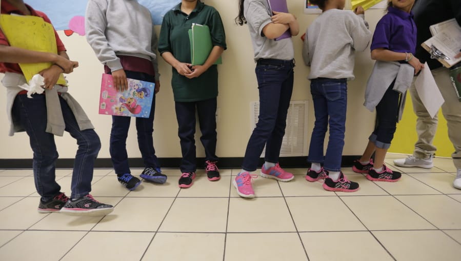 Migrant teens line up for a class at a &quot;tender-age&quot; facility for babies, children and teens, in Texas&#039; Rio Grande Valley, Thursday, Aug. 29, 2019, in San Benito, Texas. The facility offers services that include education, nutrition, hygiene, recreation, entertainment, medical, mental health and counseling, according to a U.S. Health and Human Services official.