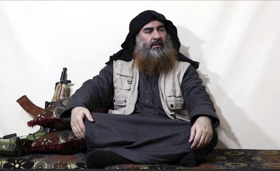 FILE - This file image made from video posted on a militant website April 29, 2019, purports to show the leader of the Islamic State group, Abu Bakr al-Baghdadi, being interviewed by his group&#039;s Al-Furqan media outlet. The IS erupted from the chaos of Syria and Iraq&#039;s conflicts and swiftly did what no Islamic militant group had done before, conquering a giant stretch of territory and declaring itself a &quot;caliphate.&quot; U.S. officials said late Saturday, Oct. 26, 2019 that al-Baghdadi was the target of an American raid in Syria and may have died in an explosion.