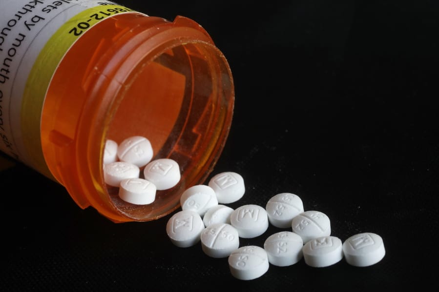FILE - This Aug. 29, 2018, file photo shows an arrangement of prescription oxycodone pills in New York. U.S. health officials are again warning doctors against abandoning chronic pain patients by abruptly stopping their opioid prescriptions. The U.S. Department of Health and Human Services instead urged doctors Thursday, Oct. 10, 2019, to share such decisions with patients.