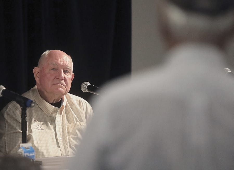 U.S. Secretary of Agriculture Sonny Perdue listens to a question from a Wisconsin farmer during a town hall meeting at the World Dairy Expo in Madison, Wis. Tuesday, Oct. 1, 2019.