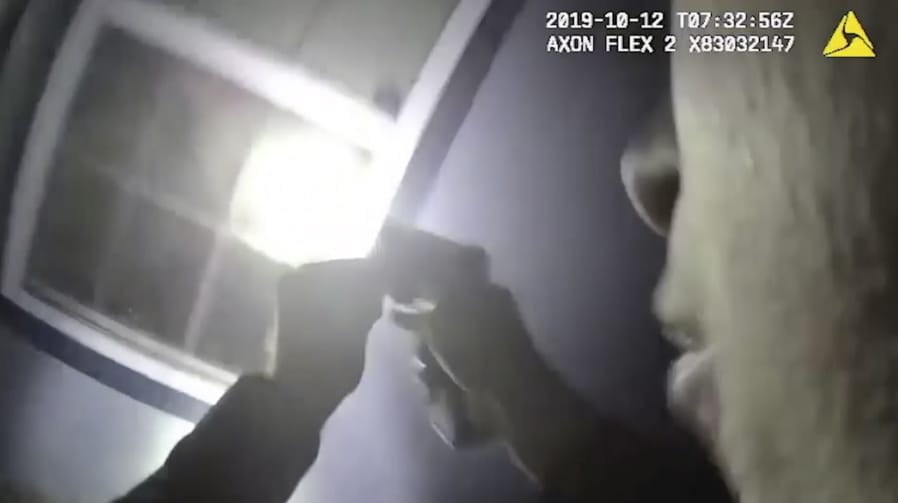 In this Saturday, Oct. 12, 2019, image made from a body camera video released by the Fort Worth Police Department an officer shines a flashlight into a window in Fort Worth, Texas. A black woman was fatally shot by a white Fort Worth, Texas, officer inside the home early Saturday after police were called to the residence for a welfare check, authorities said. The Tarrant County Medical Examiner&#039;s Office identified her as 28-year-old Atatiana Jefferson.