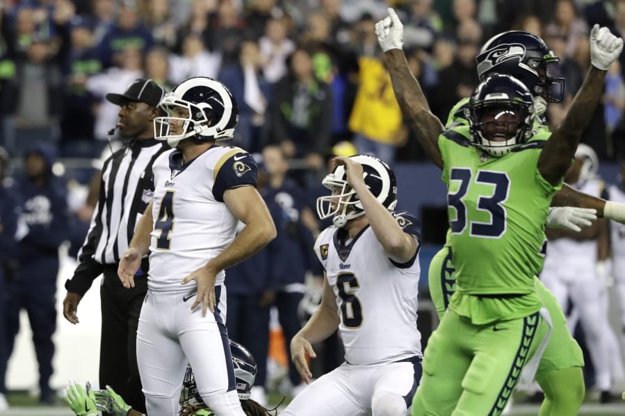 Los Angeles Rams&#039; Greg Zuerlein (4) and Seattle Seahawks free safety Tedric Thompson (33) react after Zuerlein missed a field goal in the final seconds of an NFL football game Thursday, Oct. 3, 2019, in Seattle. The Seahawks won 30-29.