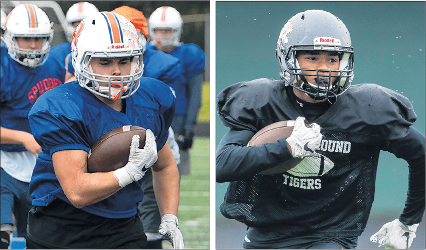 Ridgefield’s Hunter Abrams, left, and Battle Ground’s Steven Hancock know about workloads. In addition to starring on defense, they lead the region in total rushes.