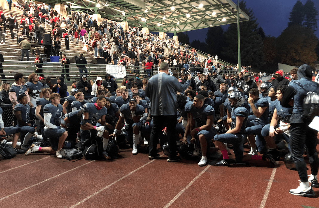 The Union football team listens to head coach Rory Rosenbach after a 56-7 win over Heritage on Friday at McKenzie Stadium.