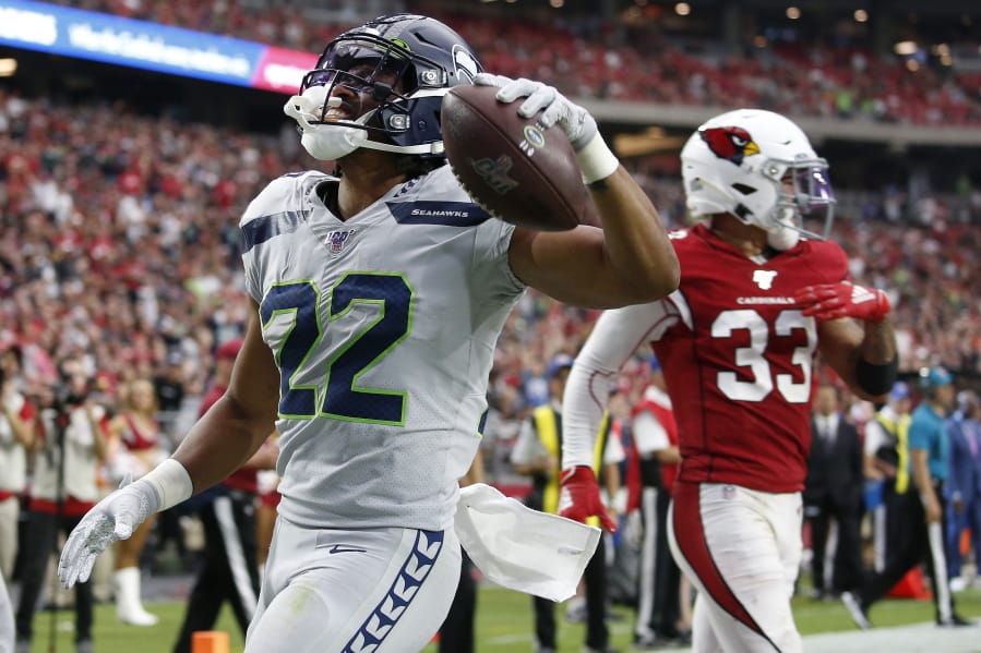 Seattle Seahawks running back C.J. Prosise (22) scores a touchdown against the Arizona Cardinals during the second half of an NFL football game, Sunday, Sept. 29, 2019, in Glendale, Ariz. (AP Photo/Ross D.