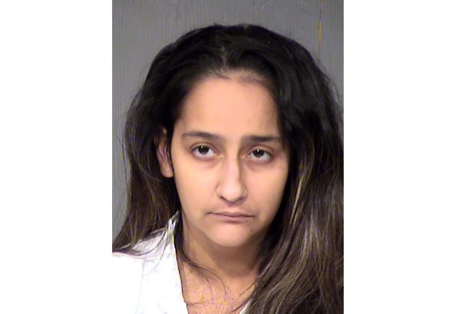 FILE - This undated file booking photo provided by the Maricopa County Sheriff shows Wendy Lavarnia. Lavarnia, who says her 2-year-old son fatally shot her 9-year-old son with a handgun that she left on a bed faces sentencing for her role in the 2017 killing. Lavarnia will face 10 to 16 years in prison Thursday, Oct.