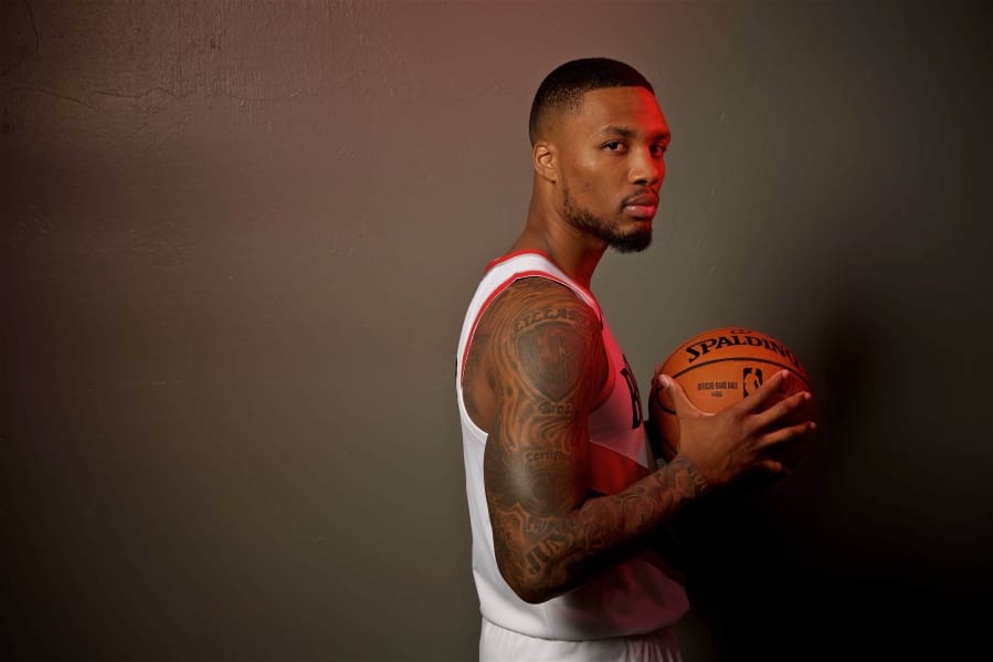 Portland Trail Blazers guard Damian Lillard poses during the NBA basketball team's media day at the Moda Center in Portland, Ore., Monday, Sept. 30, 2019.