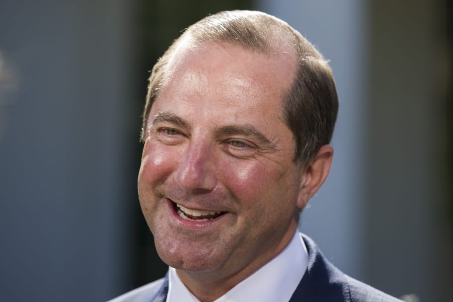 Health and Human Services Secretary Alex Azar smiles during a television interview at the White House, Monday, Oct. 21, 2019, in Washington.