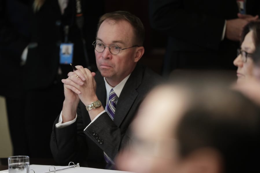 White House Chief of Staff Mick Mulvaney listers as President Donald Trump speaks during a Cabinet meeting in the Cabinet Room of the White House, Monday, Oct. 21, 2019, in Washington.