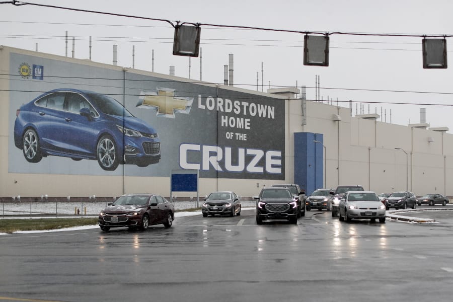 FILE - In this Nov. 27, 2018, file photo a banner depicting the Chevrolet Cruze model vehicle is displayed at the General Motors&#039; Lordstown plant in Lordstown, Ohio. An economic renaissance in the industrial Midwest promised by President Donald Trump has suffered in recent weeks in ways that could be problematic for Trump&#039;s 2020 re-election.