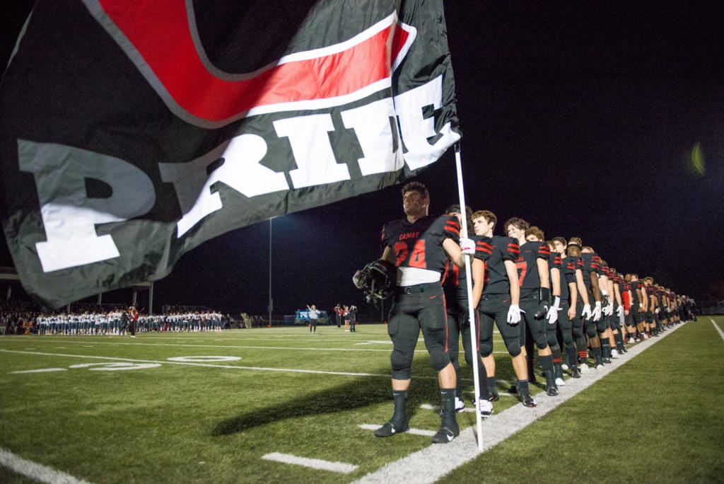 The Camas Papermakers stand during the national anthem before a game against Union at Doc Harris Stadium in Camas on Friday night, November 1, 2019. Camas beat Union 28-14.