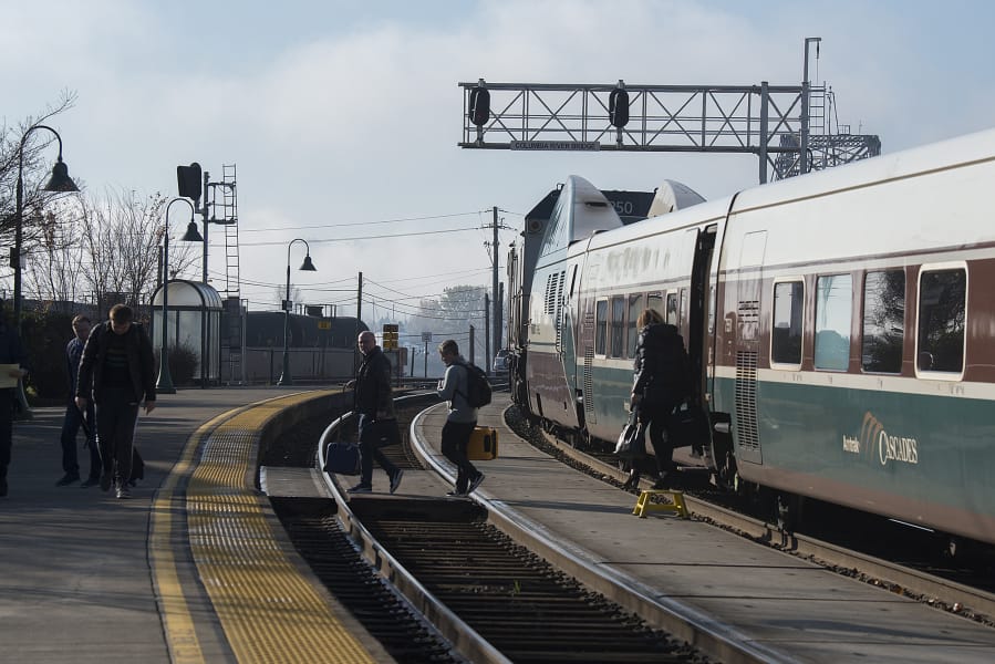Passengers make their way off an Amtrak Cascade train after arriving in Vancouver.