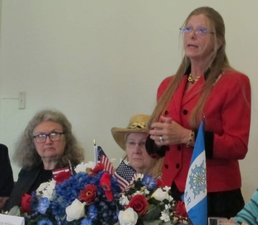 CENTRAL VANCOUVER: Barbara Hilkey, chapter regent of the Fort Vancouver Chapter of the Daughters of the American Revolution, speaks at the group&#039;s 100th anniversary luncheon Oct.