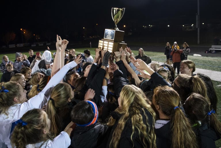 Ridgefield celebrates their 2A district championship win against Columbia River at Columbia River High School in Vancouver Nov. 7, 2019. Ridgefield won 2-1.