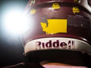 A map of Washington showing the location of Prairie High School is seen here on the back of a player's helmet.