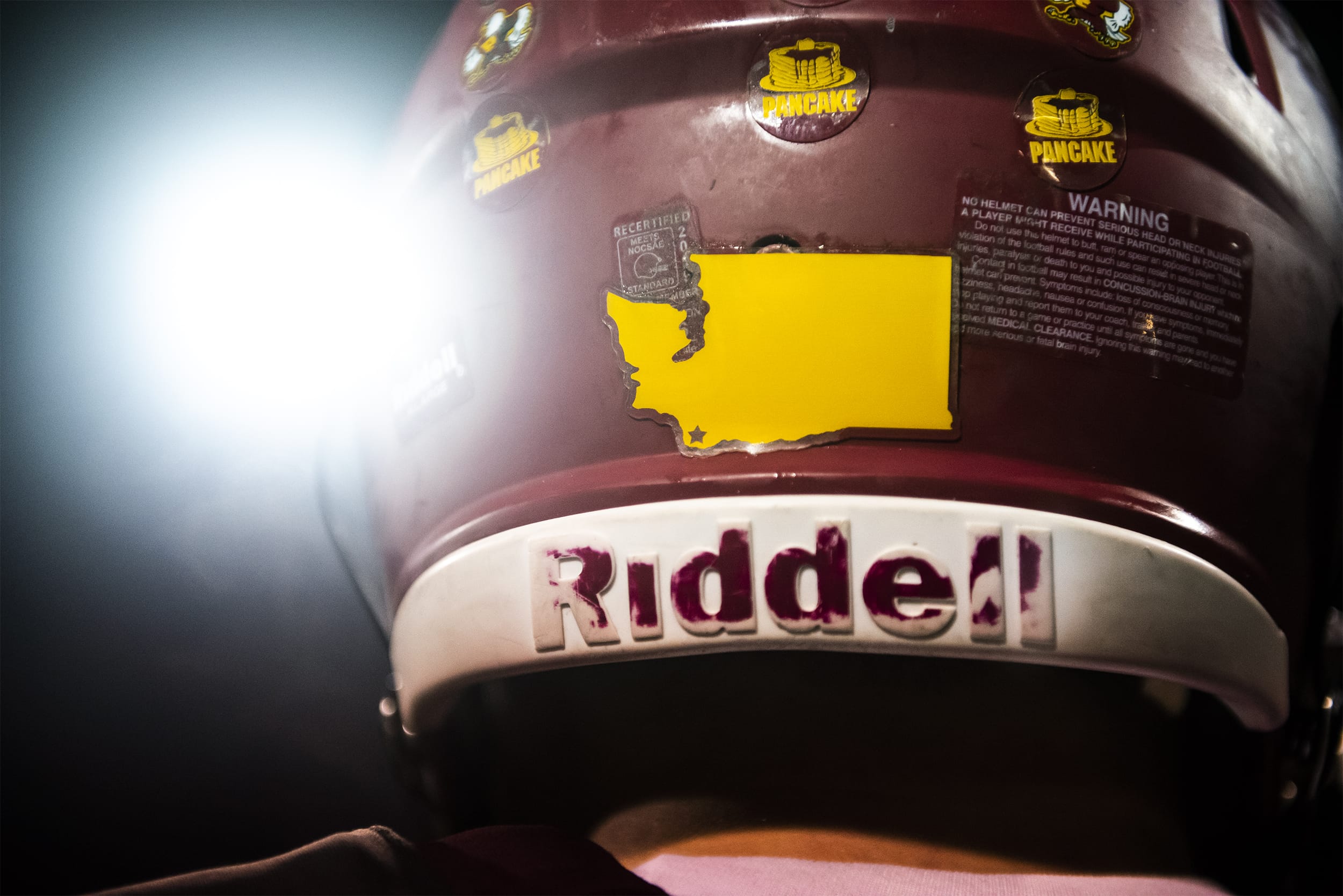 A map of Washington showing the location of Prairie High School is seen here on the back of a player's helmet.