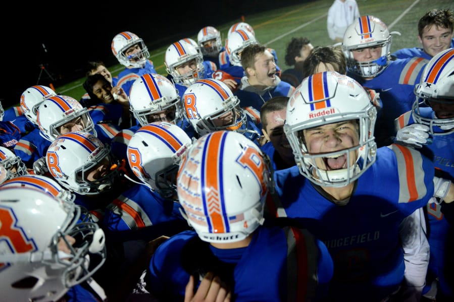 The Ridgefield Spudders celebrate a win against Aberdeen at Ridgefield High School on Saturday night, November 9, 2019. Ridgefield routed Aberdeen 49-6 to move to the state tournament.
