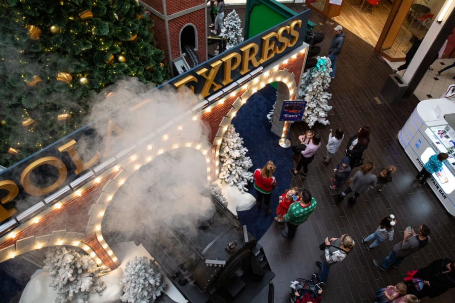Visitors wait in line at &quot;The Polar Express&quot; set to meet Santa Claus at Vancouver Mall. The set debuted this year and is more than twice the size of the mall&#039;s previous Santa display.