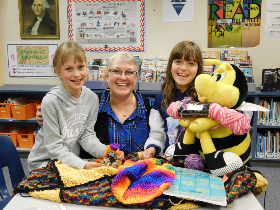 Ridgefield: South Ridge Elementary School librarian Emily Crawford, and third-graders Marta Krawczyk, left, and Liberty Glessing show their Crochet Club projects.