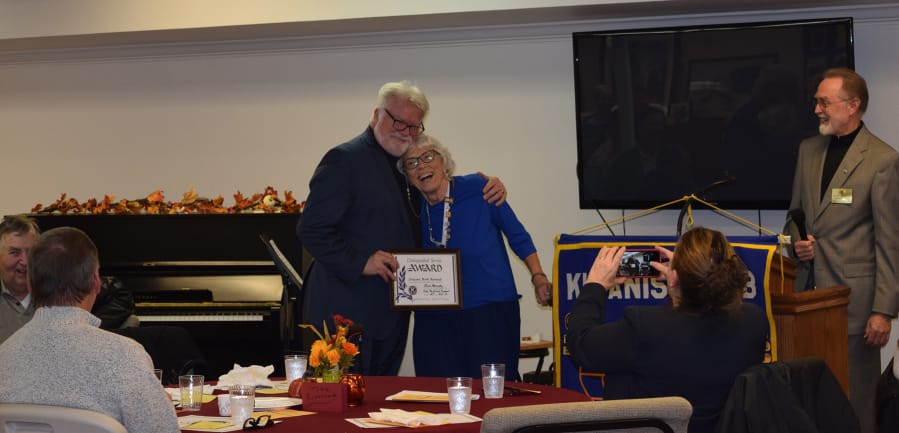 ORCHARDS: Dan Murphy of the Broadway Rose Theater and Vivian Peterson, a member of Cascade Park Kiwanis, celebrate Murphy&#039;s Distinguished Service Award at the Cascade Park Kiwanis 11th Annual Fall Festival of Service.