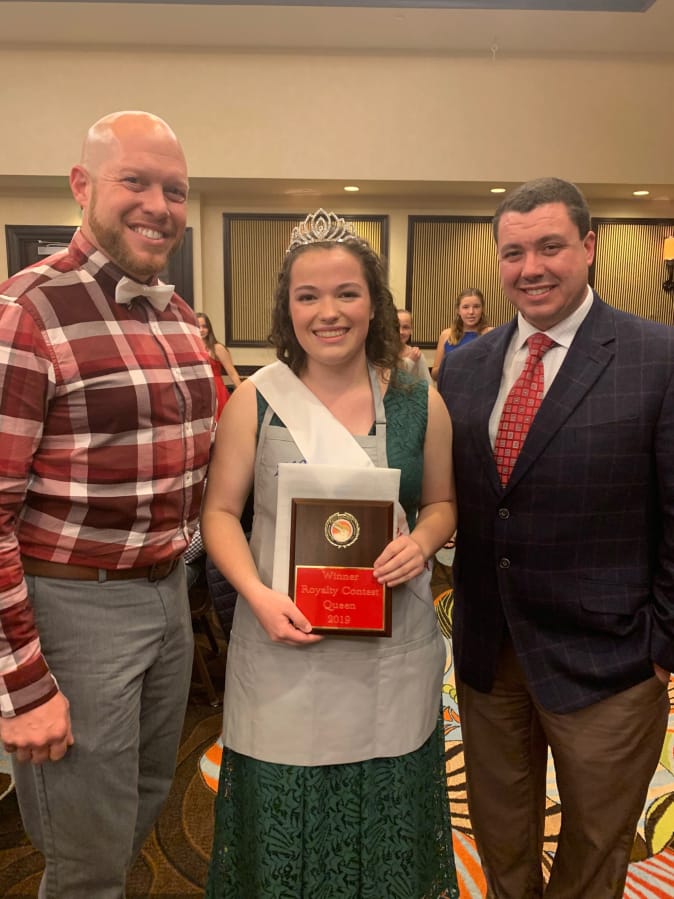 Shumway: Vancouver School of Arts and Academics senior Kate Bias, center, accepts her title of American Rabbit Breeders Association Queen with Eric Stewart, executive director of the association, left, and Josh Humphries, president of the association.