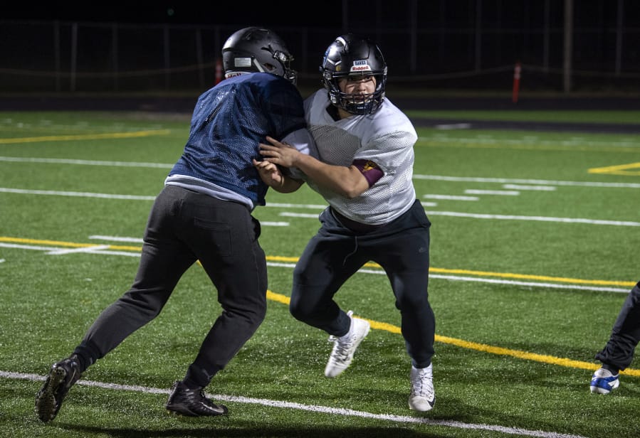 Hockinson senior Takumi Veley, right, runs through drills with his teammates during practice at District Stadium in Battle Ground Thursday, Nov. 21, 2019. Hockinson will face Lakewood on Saturday in the Class 2A state quarterfinal.