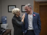 Anastasia McDonnell congratulates her husband, Barry McDonnell, after he was sworn in Tuesday as the mayor of Camas.