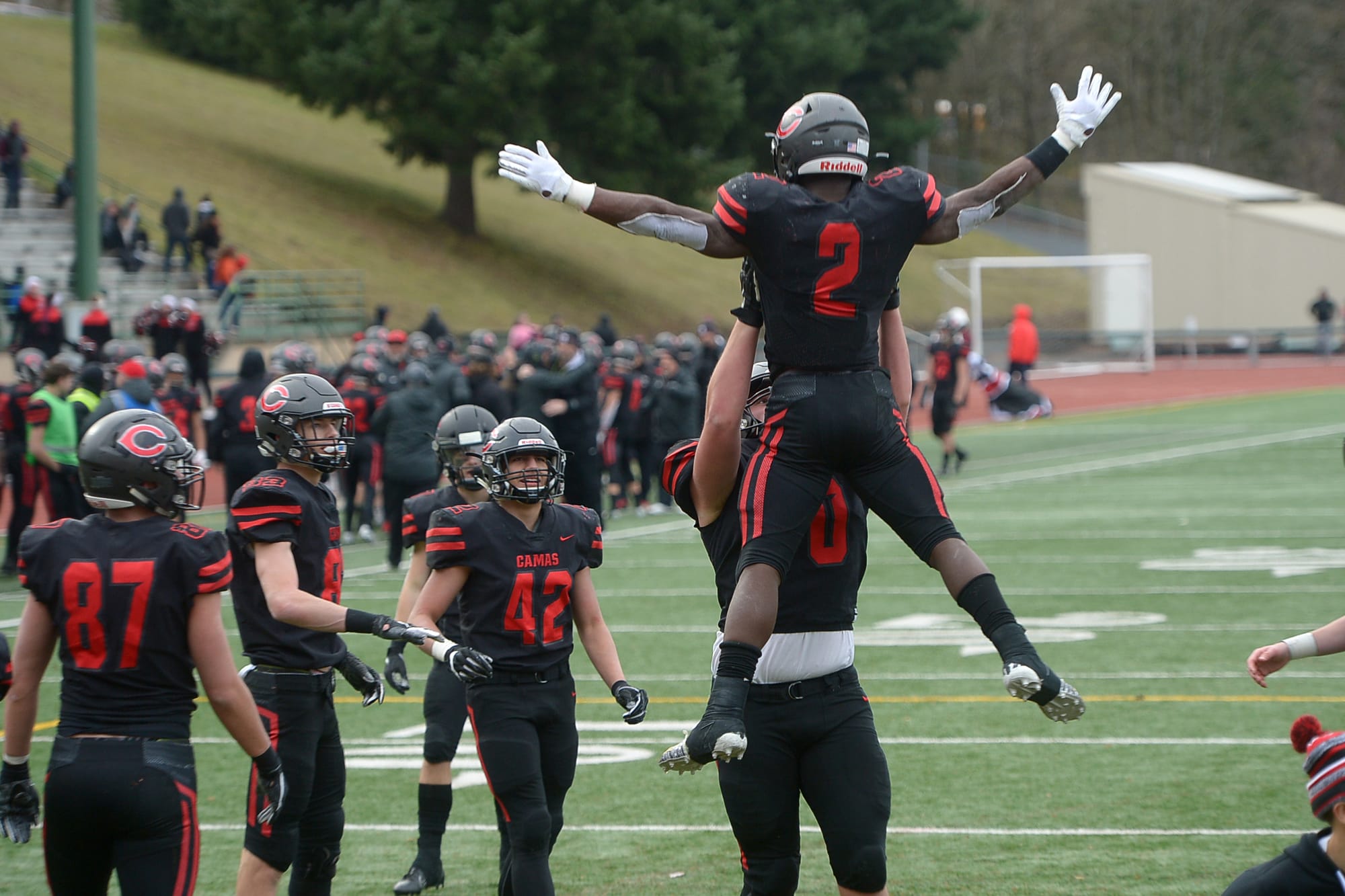 Camas running back Jacques Badolato-Birdsell is hoisted by teammate Rush Reimer after scoring a touchdown against Mount Si at McKenzie Stadium on Saturday afternoon, November 30, 2019. Camas beat Mount Si 35-14 to move on to the 4A state title game.