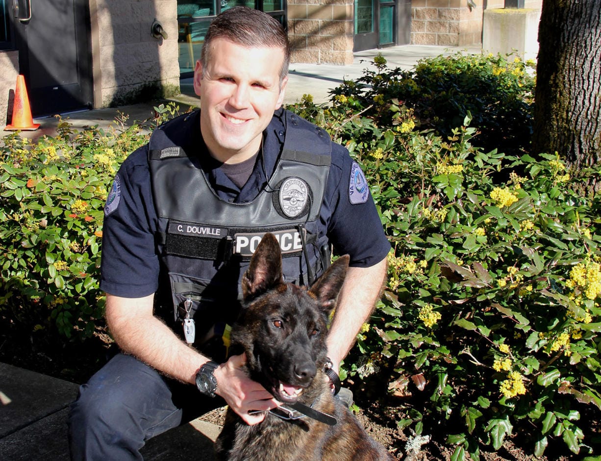 Officer Christopher Douville and Doc both recently join the Vancouver Police Office K-9 Unit. Doc, a 2-year-old Dutch Shepherd, is named in honor of Douville's father.