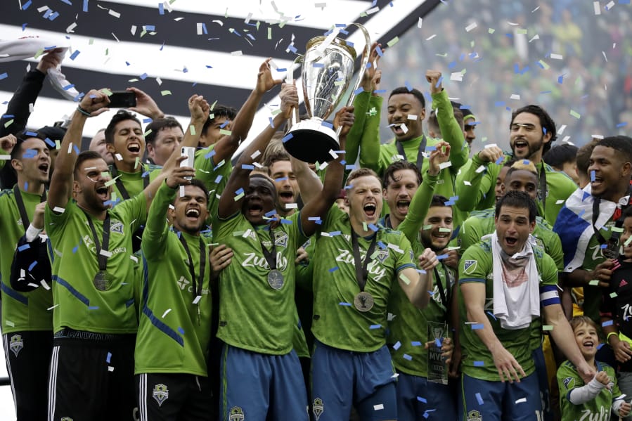 Seattle Sounders celebrate Sunday, Nov. 10, 2019, after the team beat the Toronto FC in the MLS Cup championship soccer match in Seattle. The Sounders won 3-1.