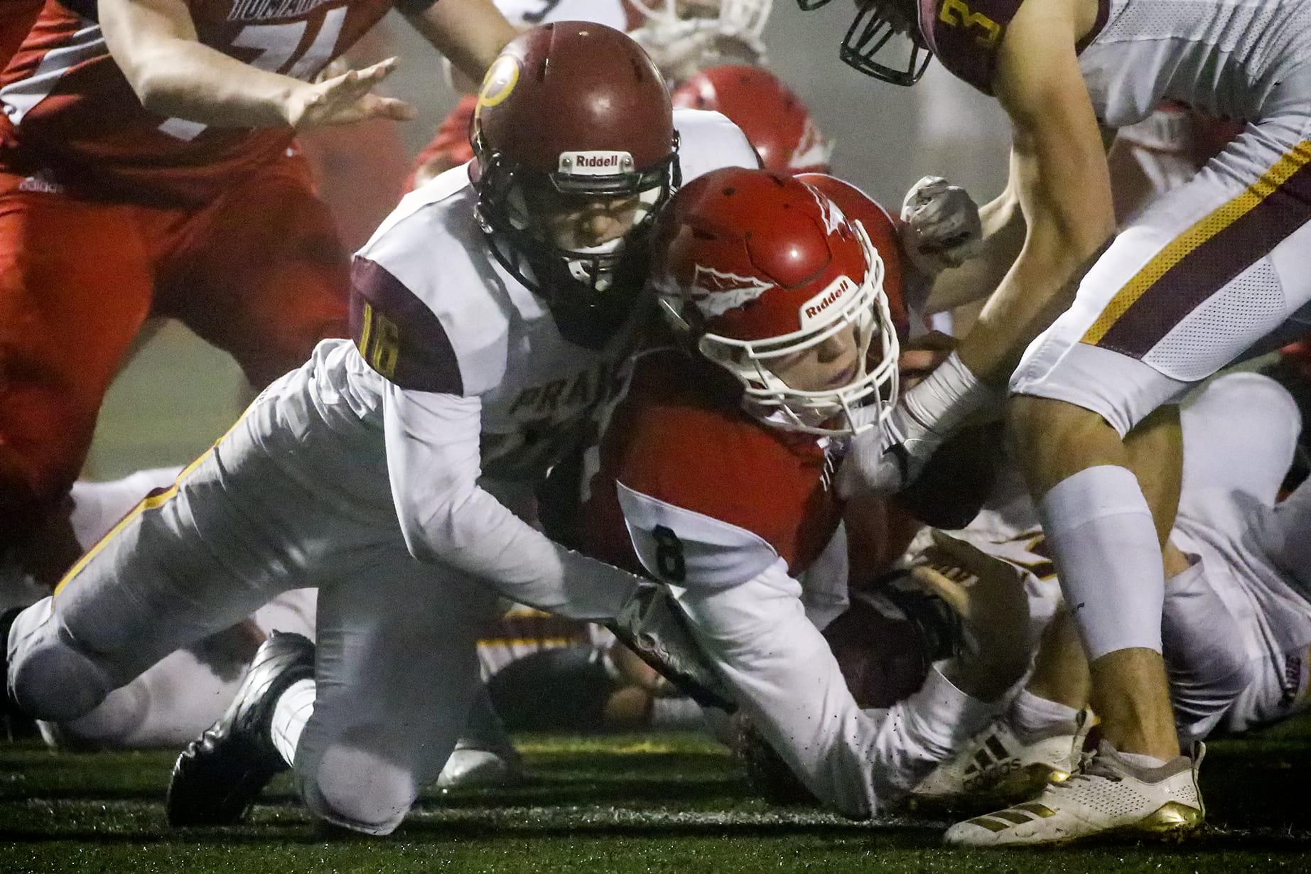 Marysville-Pilchuck's Jake Elwood falls across the goal line for a touchdown with Prairie's Nickolas Lawhead tackling Friday evening at Quil Ceda Stadium in Marysville on November 15, 2019. Marysville-Pilchuck won 37-30 in overtime.