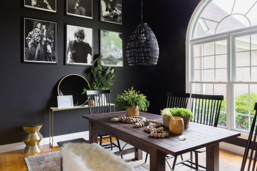 &quot;Whether sleek and modern or rustic farmhouse, black paint and decor offers a sophisticated air to many different looks,&quot; says Briana Nix, who designed this black dining space.