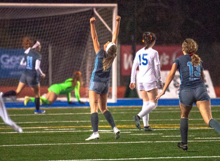 Hockinson's Megan Meindersee lifts her arms in celebration after scoring the Hawks' second goal in a 2-0 victory over Ridgefield in the 2A State semifinals Friday at Shoreline Stadium.