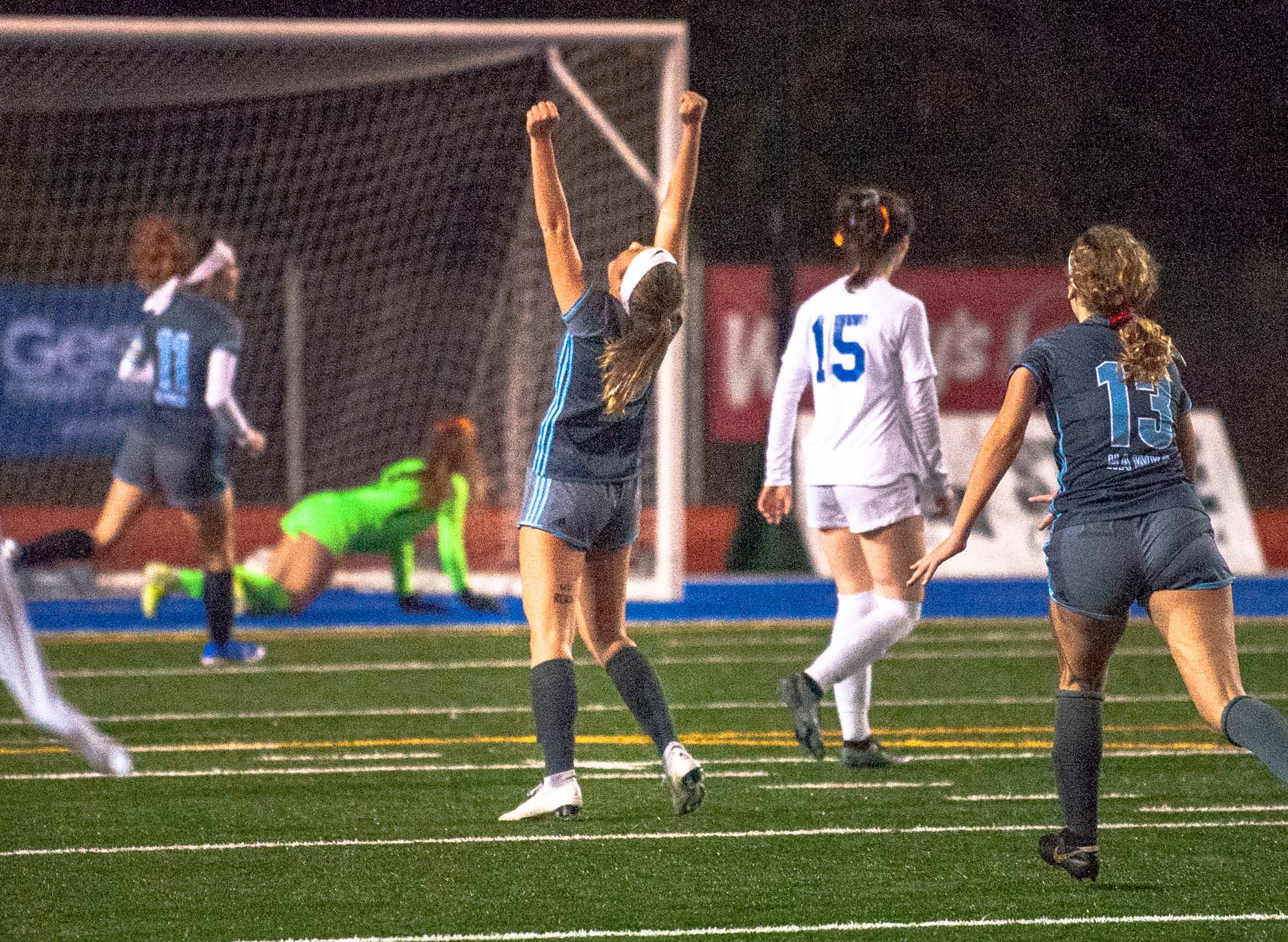 Hockinson's Megan Meindersee lifts her arms in celebration after scoring the Hawks' second goal in a 2-0 victory over Ridgefield in the 2A State semifinals Friday at Shoreline Stadium.