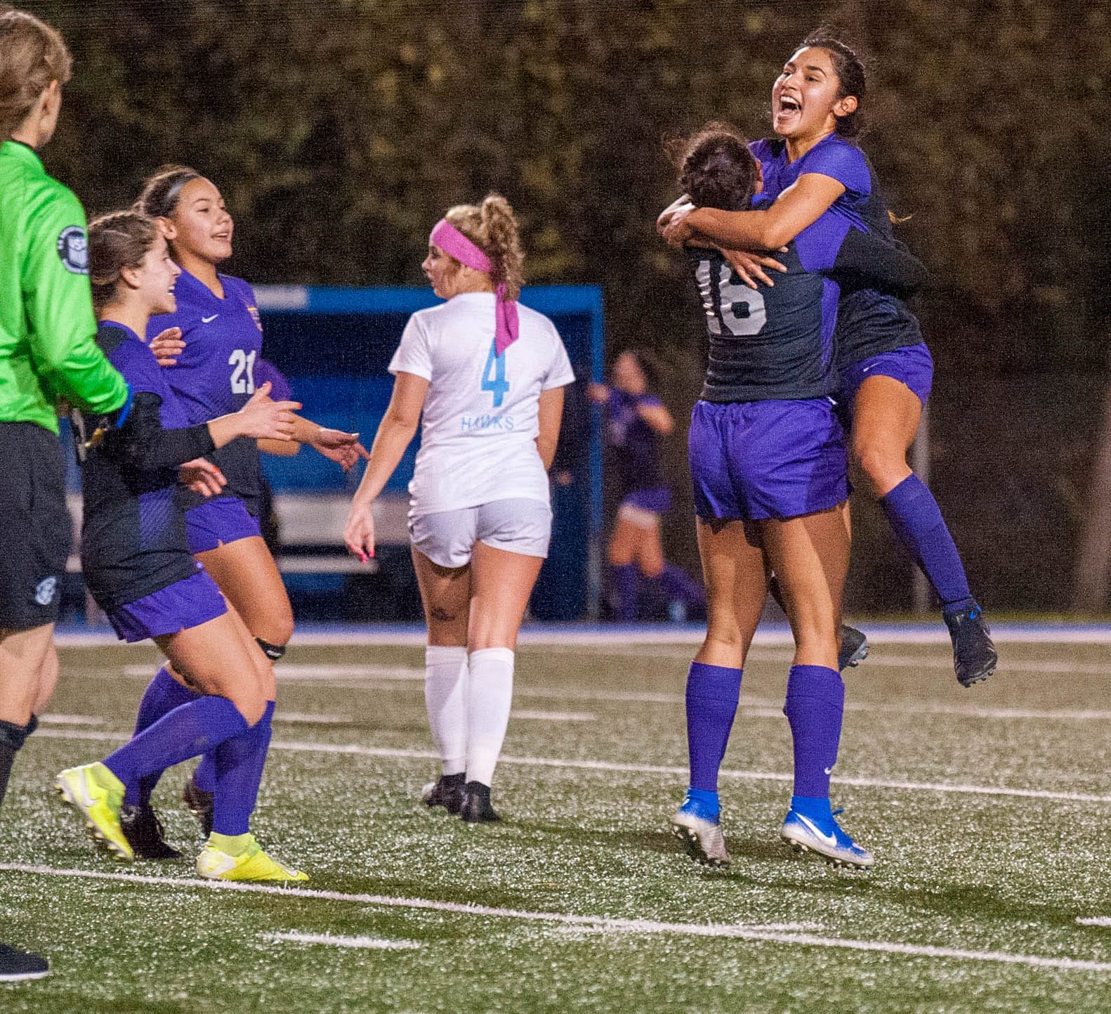 Columbia River's Yaneisy Rodriguez, right, is lifted by teammate Shalece Easley after Rodriguez netted the game's lone goal in a 1-0 win over Hockinson in the 2A State Championship.