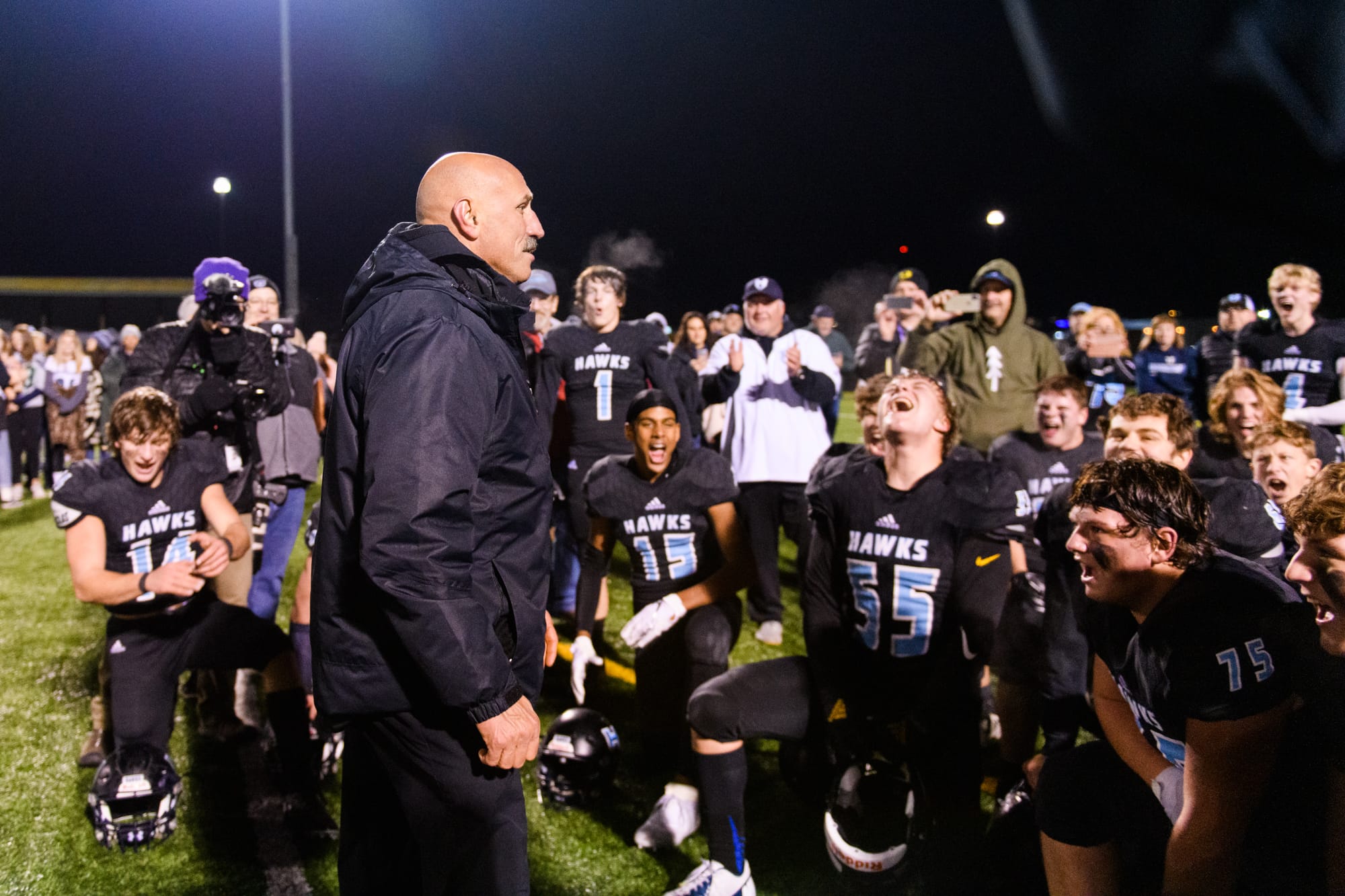 Hockinson Coach Rick Steele tells the team how proud he is of them as they celebrate their 29-28 win over Lakewood in a quarterfinal game on Saturday, Nov. 23, 2019, at Battle Ground District Stadium. (Molly J.