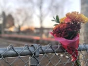 A bouquet of flowers had been placed in the fence on 104th Street near the driveway of Sarah J. Anderson Elementary School on Thursday morning.