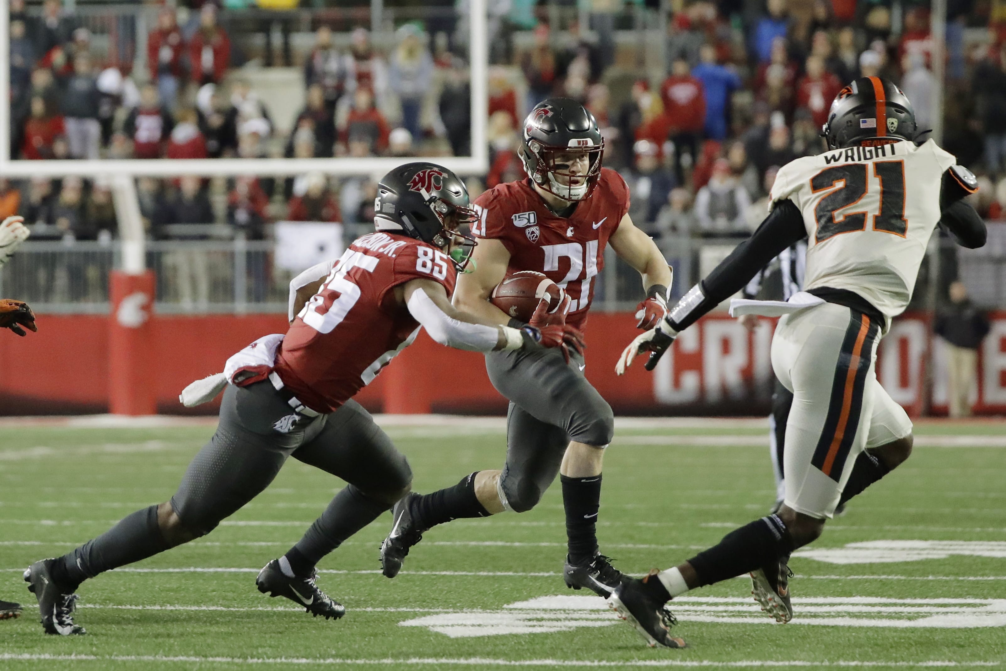 Washington State running back Max Borghi, center, rushes against Oregon State during the second half of an NCAA college football game, Saturday, Nov. 23, 2019, in Pullman, Wash. Washington State won 54-53. (AP Photo/Ted S.