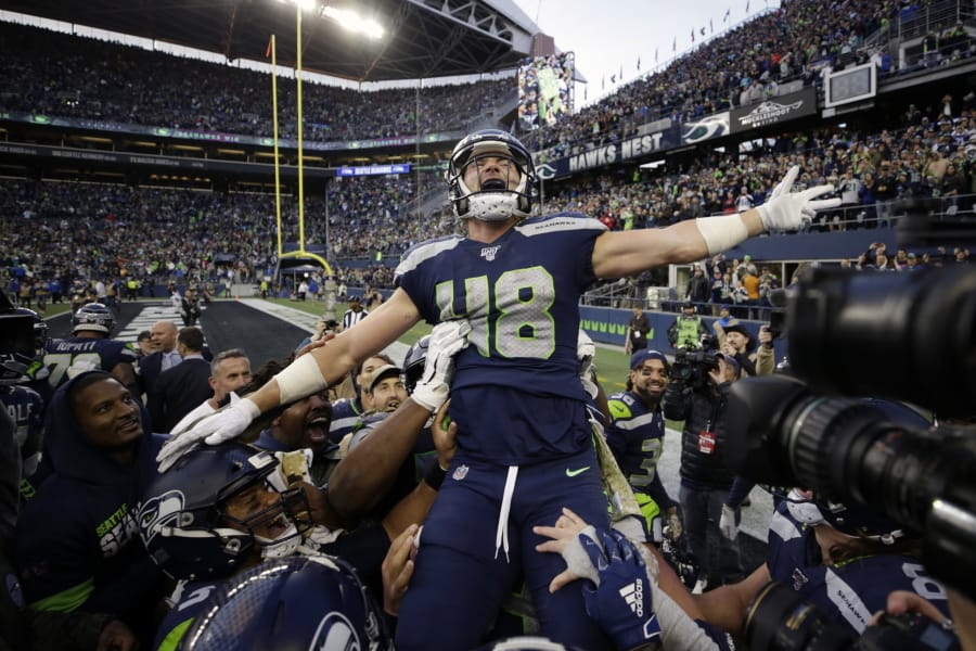 Seattle Seahawks tight end Jacob Hollister celebrates after he scored a touchdown against the Tampa Bay Buccaneers in overtime of an NFL football game Sunday, Nov. 3, 2019, in Seattle.