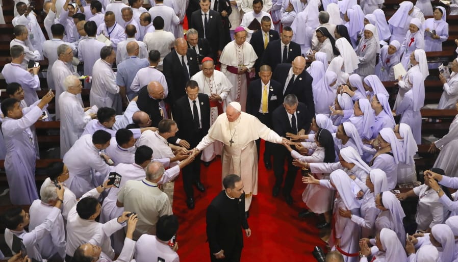 Priests, religious seminarians and Catechists touch the hands of Pope Francis as he leaves after meeting them at Saint Peter&#039;s Parish on the outskirts of Bangkok, Thailand, Friday, Nov. 22, 2019. Pope Francis urged more efforts to combat the &quot;humiliation&quot; of women and children forced into prostitution as he began a busy visit Thursday to Thailand, where human trafficking and poverty help fuel the sex tourism industry.