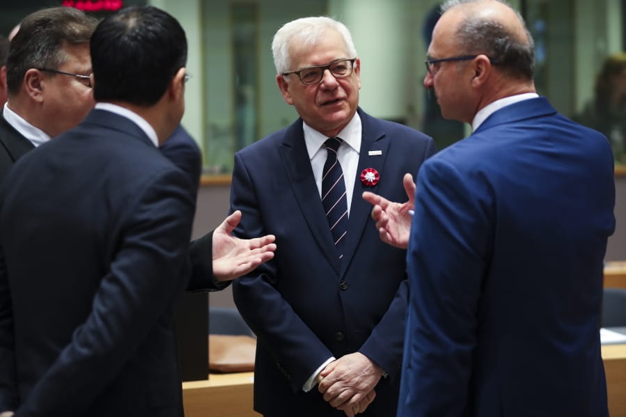 Polish Foreign Minister Jacek Czaputowicz, second right, talks to Lithuanian Foreign Minister Linas Linkevicius, left, Malta&#039;s Foreign Minister Carmelo Abela, second left, and Croatian Foreign Minister Gordan Grlic Radman during an European Foreign Affairs Ministers meeting at the Europa building in Brussels, Monday, Nov. 11, 2019. European Union foreign ministers are discussing ways to keep the Iran nuclear deal intact after the Islamic Republic began enrichment work at its Fordo enrichment facility.