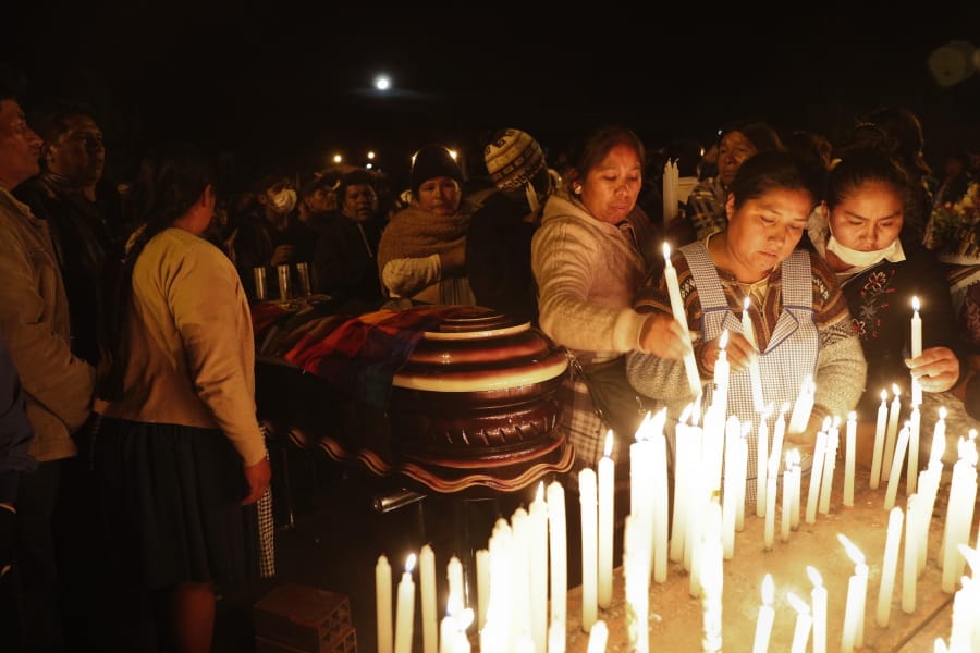 Mourners light candles around coffins of backers of former President Evo Morales that died during clashes with security forces in Sacaba, Bolivia, Friday, Nov. 15, 2019. Bolivian security forces clashed with Morales&#039; backers leaving at least five people dead, dozens more injured and escalating the challenge to the country&#039;s interim government to restore stability.