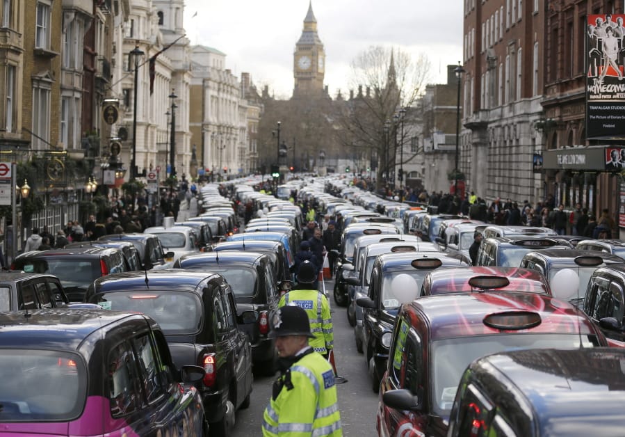 FILE - In this Wednesday, Feb. 10, 2016 file photo, London taxis block the roads during a protest in central London, concerned with unfair competition from services such as Uber. London&#039;s transit operator says it is not renewing Uber&#039;s license to operate in the British capital. Uber&#039;s license expires Monday Nov. 25, 2019.